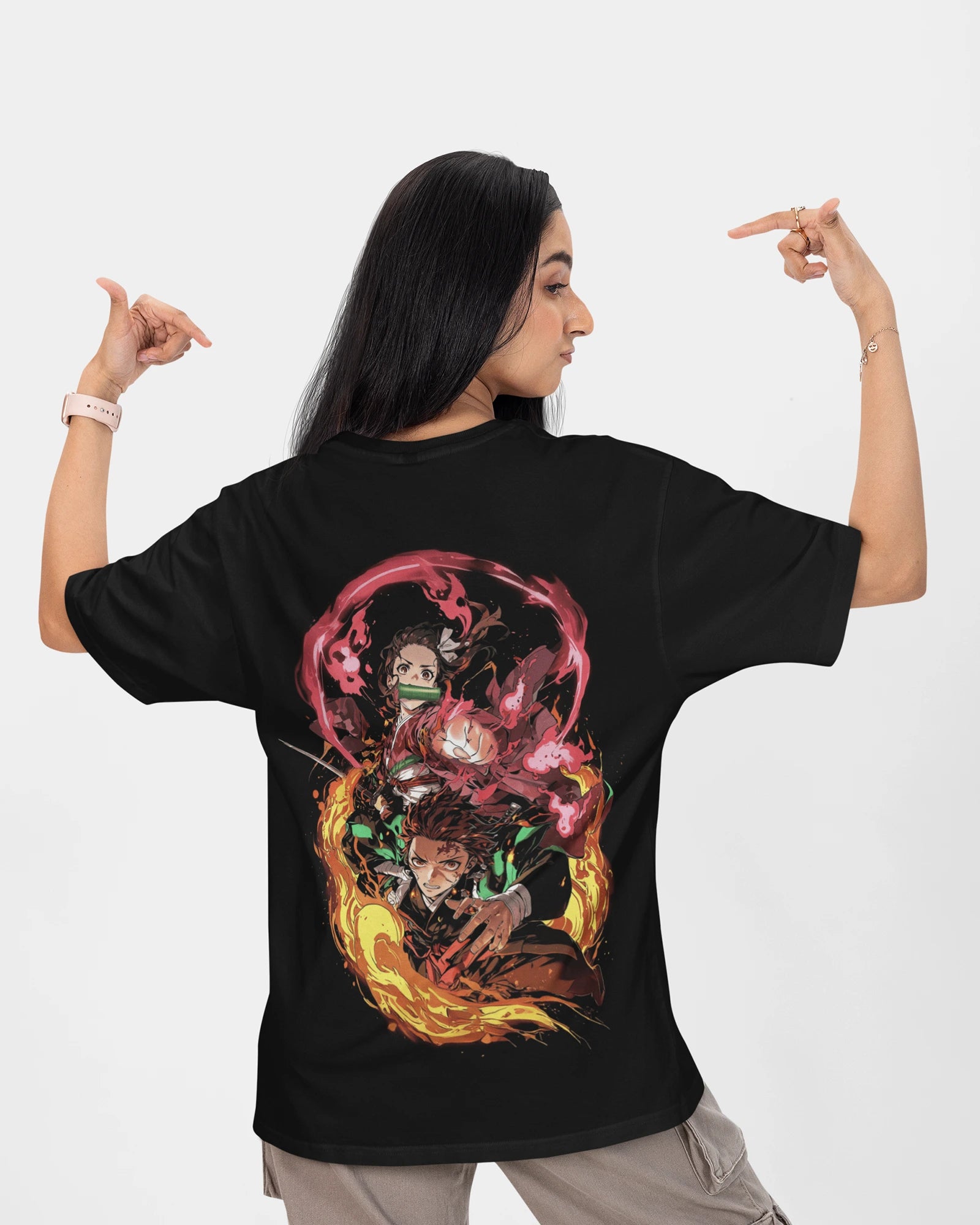 Model wearing black oversized Demon Slayer t-shirt featuring Tanjiro and Nezuko designs, made from 240 GSM cotton.